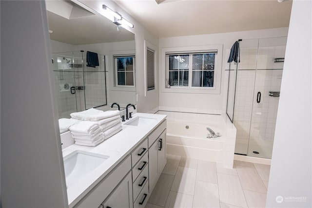 bathroom featuring tile patterned flooring, vanity, and shower with separate bathtub