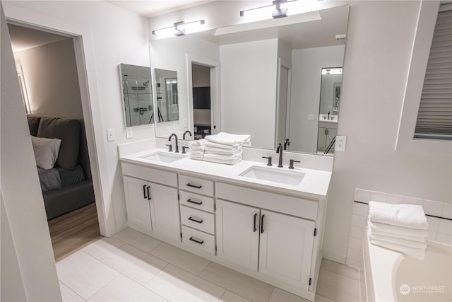 bathroom with tile patterned flooring and vanity