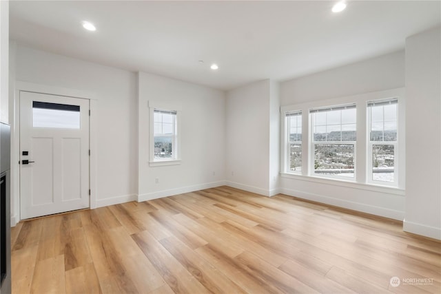 foyer with light hardwood / wood-style flooring