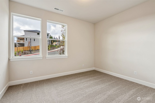 unfurnished room with carpet floors