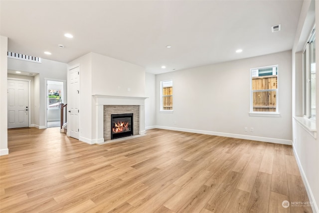 unfurnished living room with light hardwood / wood-style floors