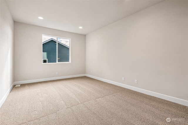 spare room featuring carpet floors