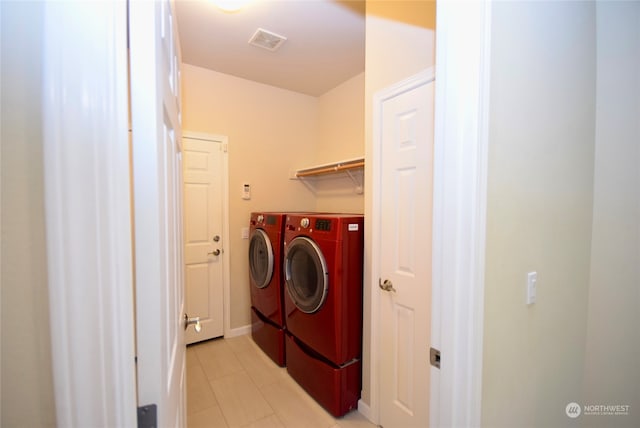 washroom with washer and dryer