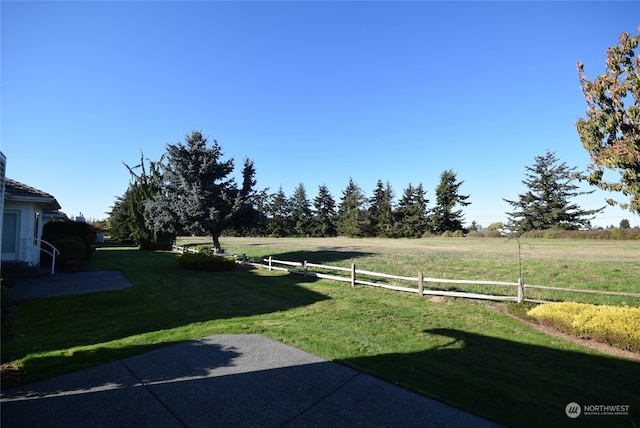 view of yard with a rural view