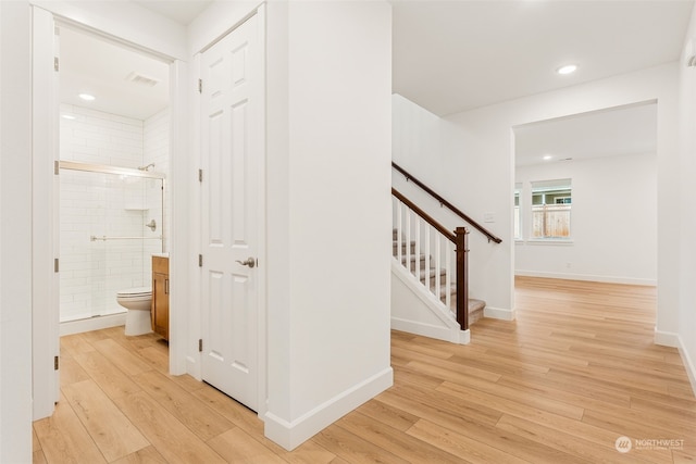 hall with light hardwood / wood-style flooring