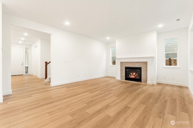 unfurnished living room featuring light hardwood / wood-style floors