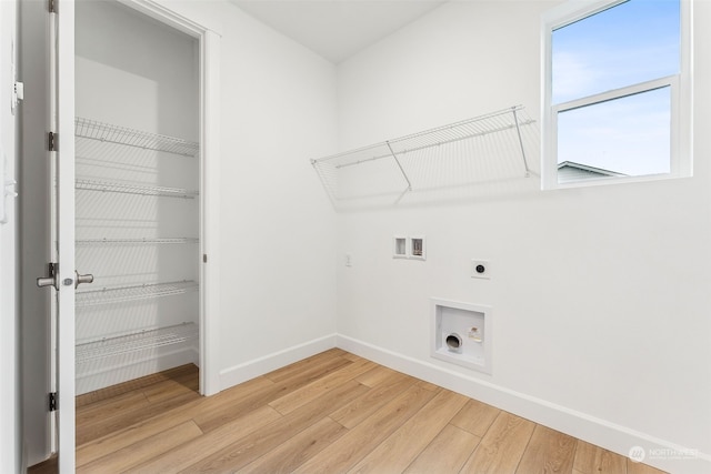 laundry room with hookup for an electric dryer, wood-type flooring, and hookup for a washing machine