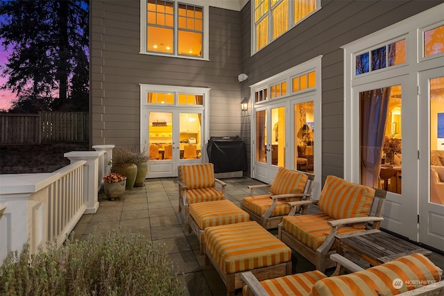 patio terrace at dusk featuring outdoor lounge area