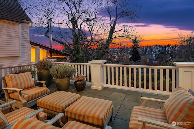 view of patio terrace at dusk