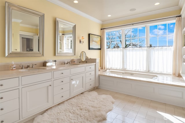 bathroom with tile patterned flooring, crown molding, a tub to relax in, and vanity