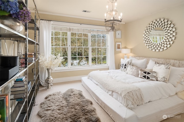 bedroom with crown molding, a chandelier, and carpet