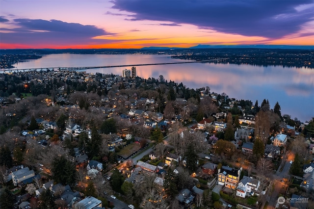 aerial view at dusk with a water view