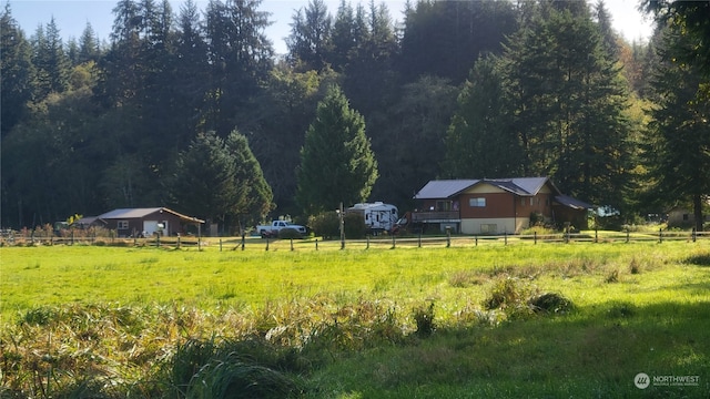 view of yard with a rural view