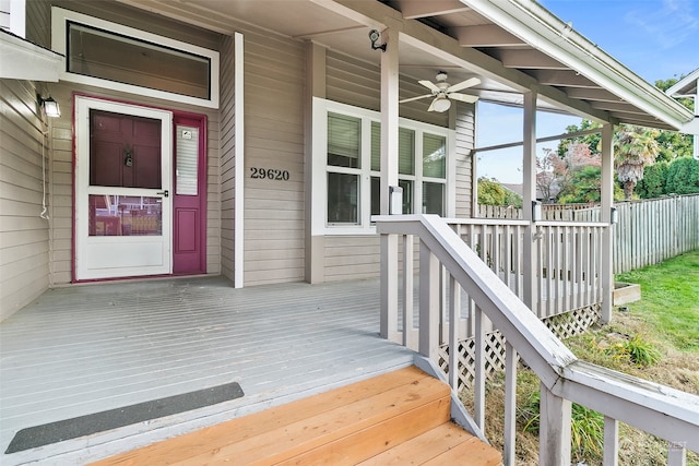 doorway to property with ceiling fan and covered porch