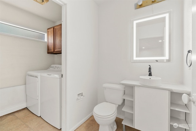 bathroom with vanity, independent washer and dryer, toilet, and tile patterned floors