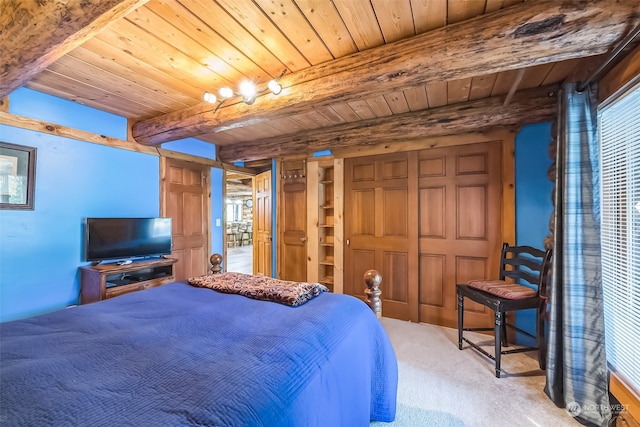 carpeted bedroom with beam ceiling and wooden ceiling