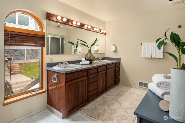 2210E Mason Lake Dr W, Grapeview, WA 98546 - bathroom featuring baseboards and double vanity