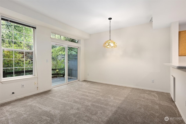 interior space with a wealth of natural light and baseboards