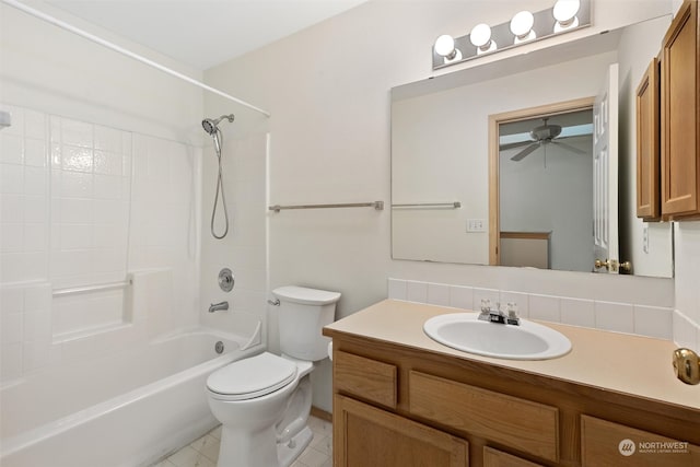 bathroom with vanity, toilet, ceiling fan, and shower / bath combination