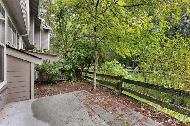 view of patio featuring fence