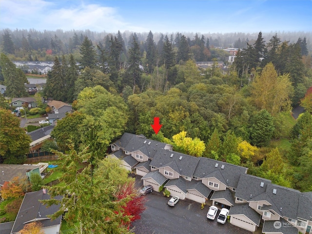 birds eye view of property featuring a residential view and a view of trees