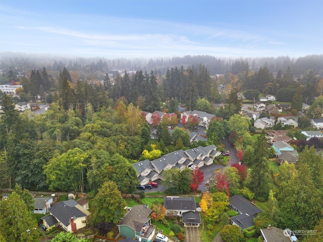 bird's eye view featuring a wooded view