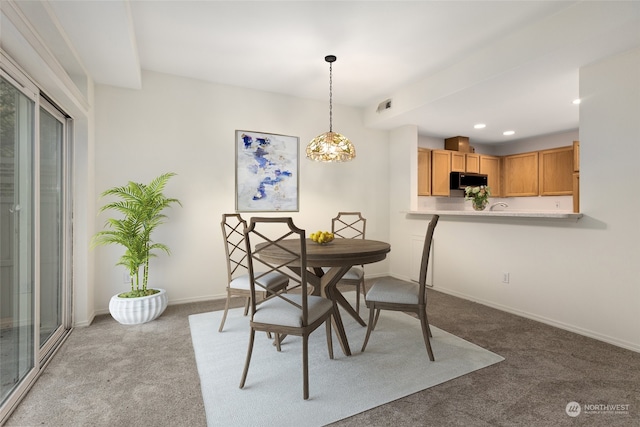 carpeted dining area with visible vents, recessed lighting, and baseboards