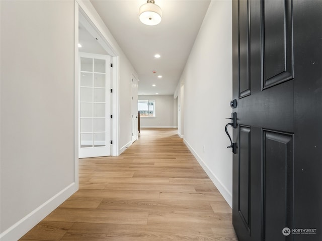 hallway featuring light hardwood / wood-style flooring