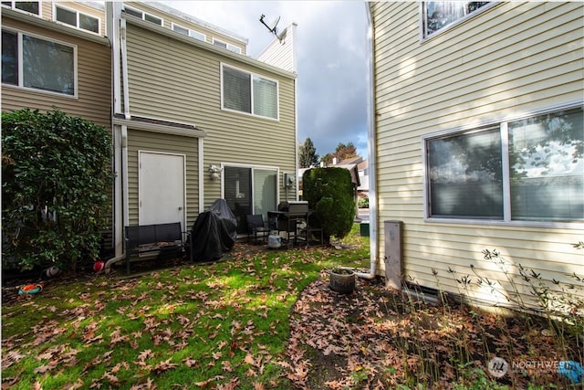 back of house with a patio area