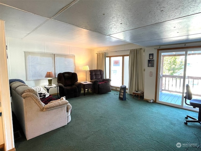 living room featuring a healthy amount of sunlight and carpet