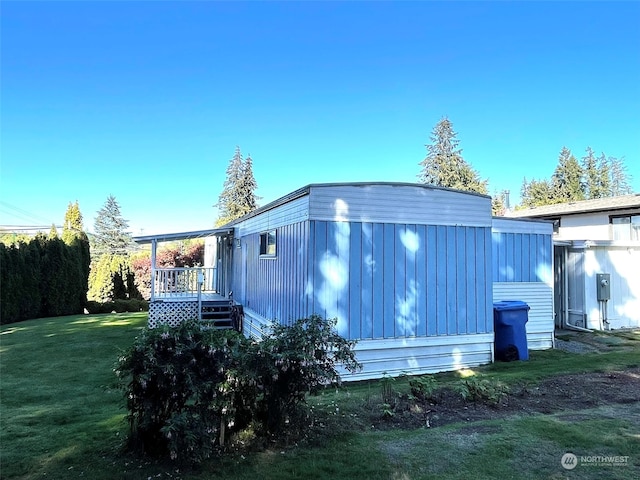 view of home's exterior with a yard