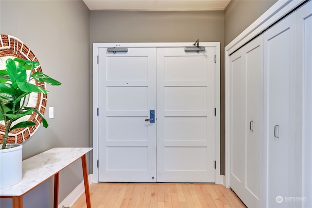 doorway with light wood-type flooring