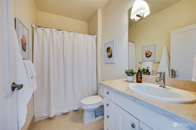 bathroom featuring toilet, tile patterned flooring, vanity, and walk in shower