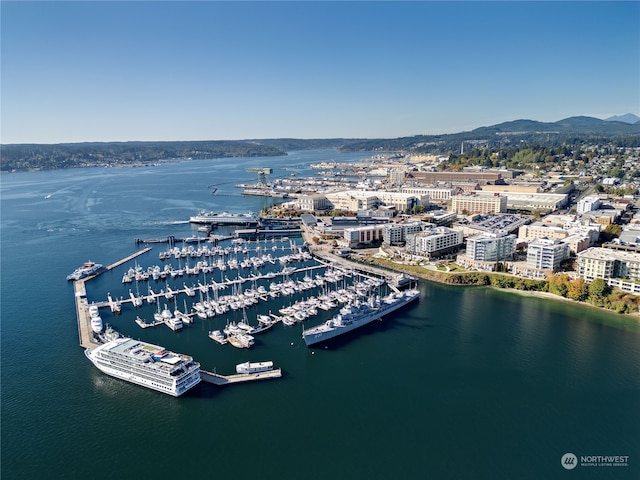 drone / aerial view featuring a water and mountain view