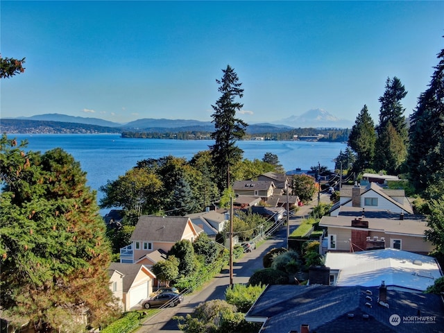 bird's eye view with a water and mountain view