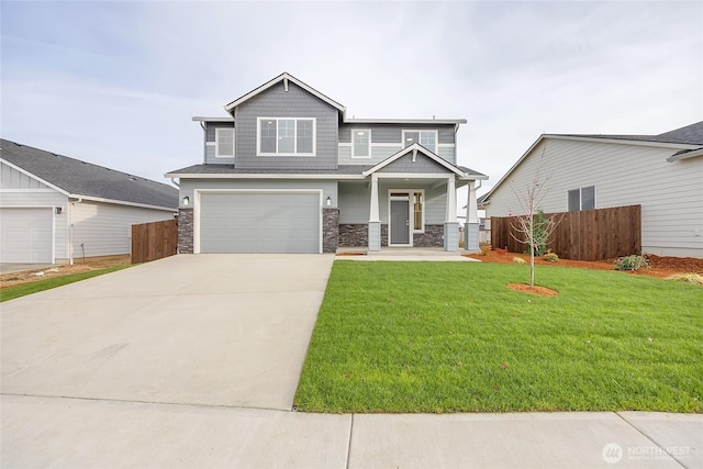 craftsman-style house with a front yard and a garage