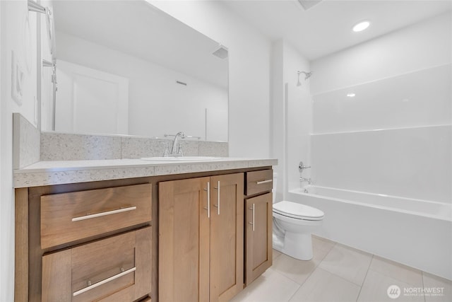 full bathroom featuring tile patterned floors, vanity, shower / bathtub combination, and toilet