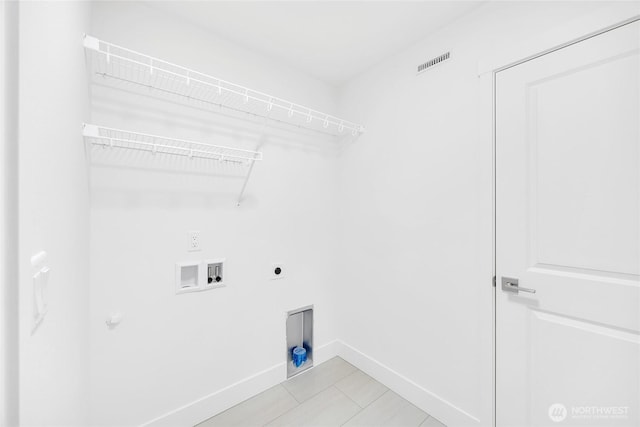 clothes washing area featuring hookup for a gas dryer, electric dryer hookup, and hookup for a washing machine