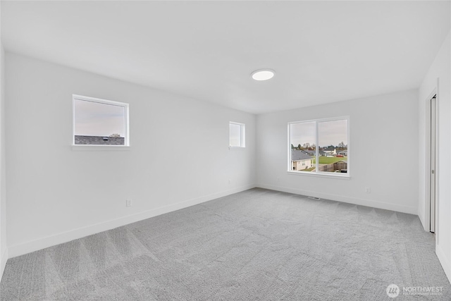 empty room with light colored carpet