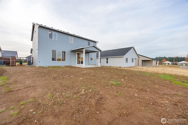 back of house with central air condition unit and a patio