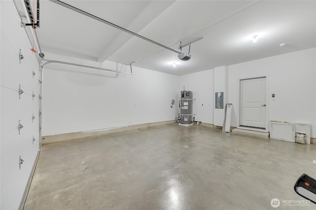 garage featuring electric panel, secured water heater, and a garage door opener