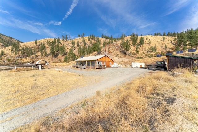 exterior space with a mountain view and a rural view