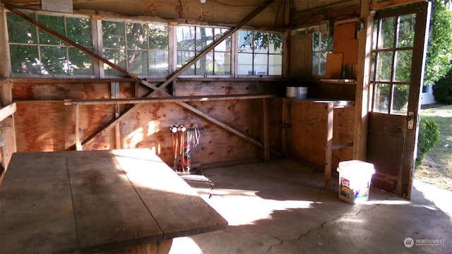 1555 Swartout Rd, Manson, WA 98831 - misc room with healthy amount of natural light and unfinished concrete floors