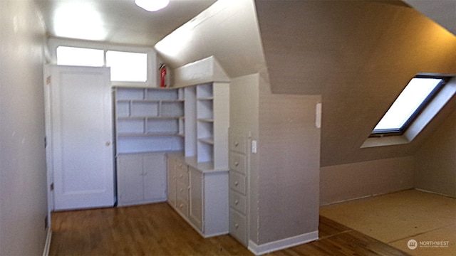 1555 Swartout Rd, Manson, WA 98831 - additional living space with wood finished floors, a skylight, and vaulted ceiling