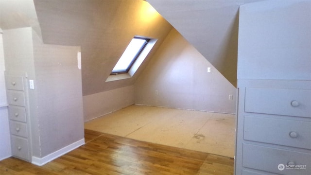 1555 Swartout Rd, Manson, WA 98831 - bonus room with a skylight, vaulted ceiling, and wood finished floors
