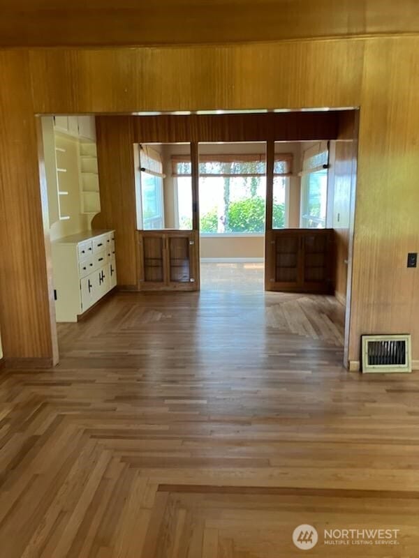 1555 Swartout Rd, Manson, WA 98831 - doorway to outside featuring wooden walls