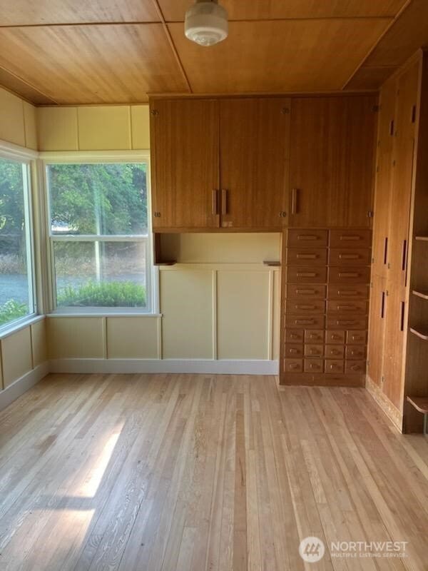 1555 Swartout Rd, Manson, WA 98831 - spare room with wood ceiling and light wood finished floors