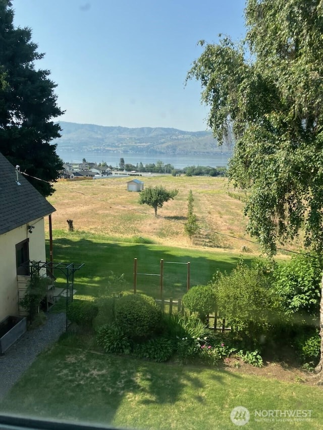 1555 Swartout Rd, Manson, WA 98831 - view of green lawn featuring a mountain view