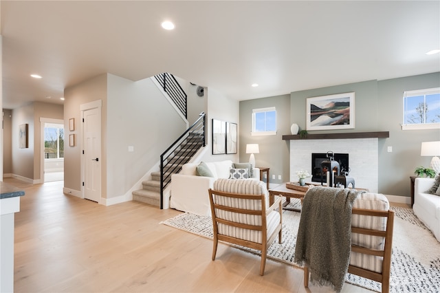 living room featuring light hardwood / wood-style flooring and a healthy amount of sunlight