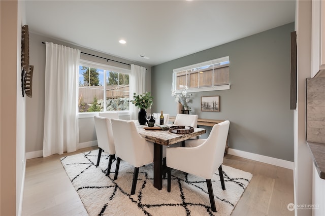 dining room with light wood-type flooring